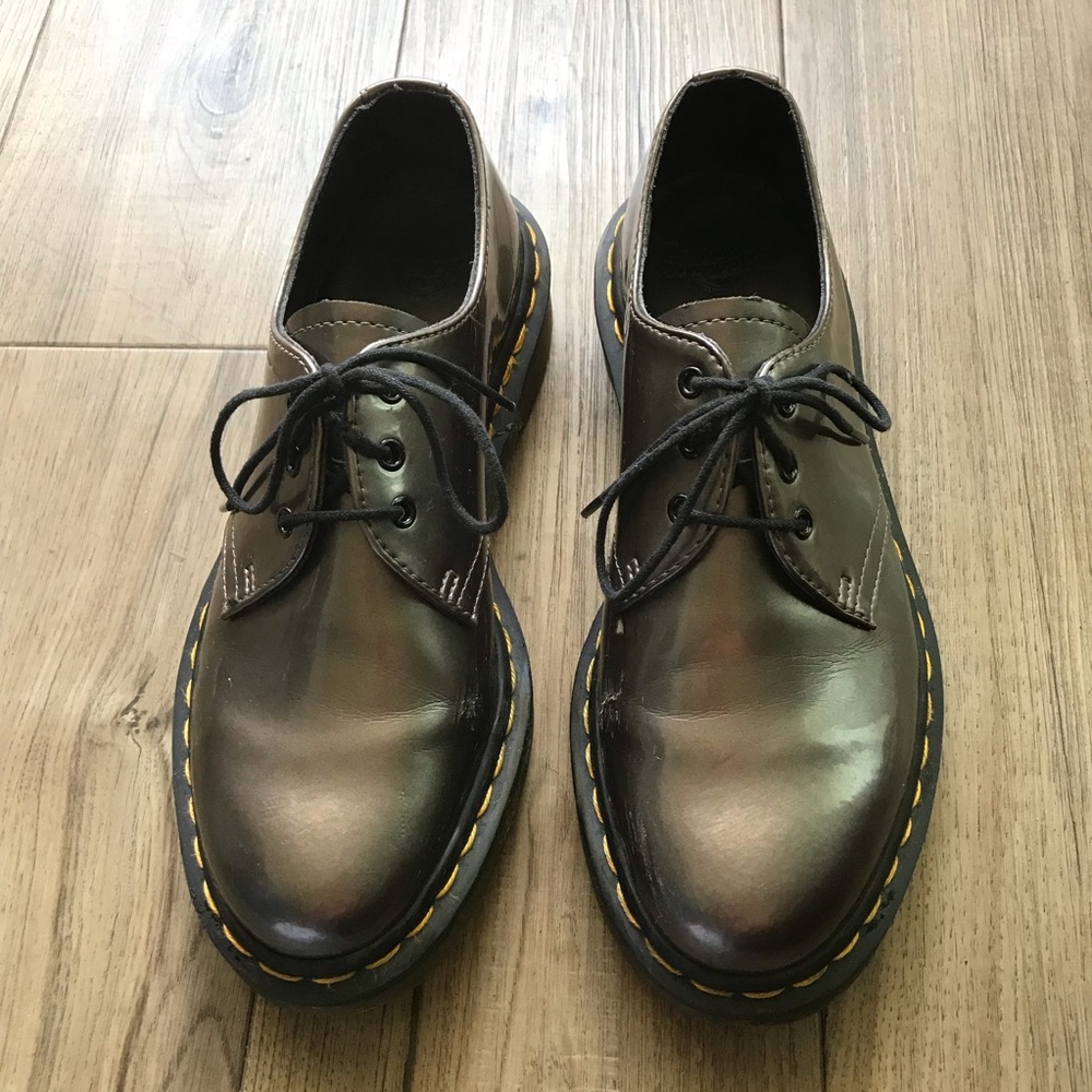 Silver Dr. Martens lace up loafers.